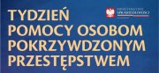 Grafika obrazkowa. Niebieska plansza z napisem &quot; Tydzień pomocy osobom pokrzywdzonych przestępstwem&quot;.
