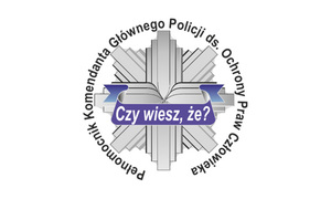 Policyjna Gwiazda z obwodowym napisem o treści Pełnomocnik KGP do spraw ochrony praw człowieka.