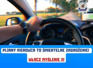 Grafika obrazkowa. Widok na kierownicę i drogę przez przednią szybę pojazdu. Napis o treści: Pijany kierowca to śmiertelne zagrożenie! Włącz myślenie!